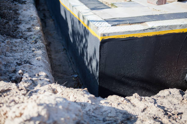 Professional Basement Waterproofing technician working in Geneva, IN